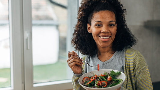 How your diet can affect your eczema. Woman eating mixed salad